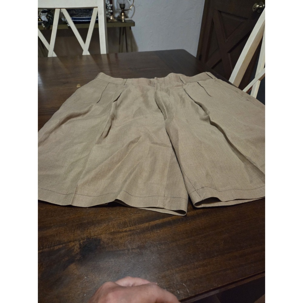 Harold Powell khaki, pleated shorts feature a structured herringbone texture